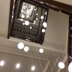 Luxury LED Chandelier with Crystal Orb Shade for Modern Staircases