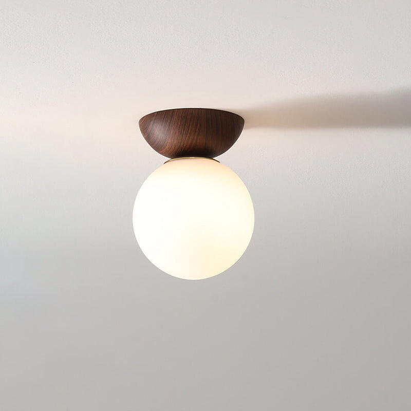 Contemporary Glass and Iron Orb 1-Light Semi-Flush Mount
