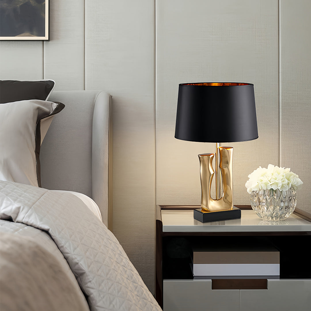 Elegant Gold and Black Sculptural Table Lamp with Drum Shade