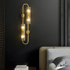 Elegant 4-Light Oval Brass Wall Sconce with Clear Glass Shade