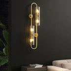 Elegant 4-Light Oval Brass Wall Sconce with Clear Glass Shade